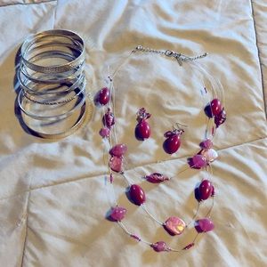 Silver and puckish necklace and silver bracelets
